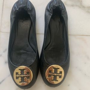 Black leather with gold emblem. Well loved-scratches & scuffs to toe and heel.